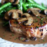 Savor Grilled Pork Chops with Rich, Creamy Mushroom Sauce